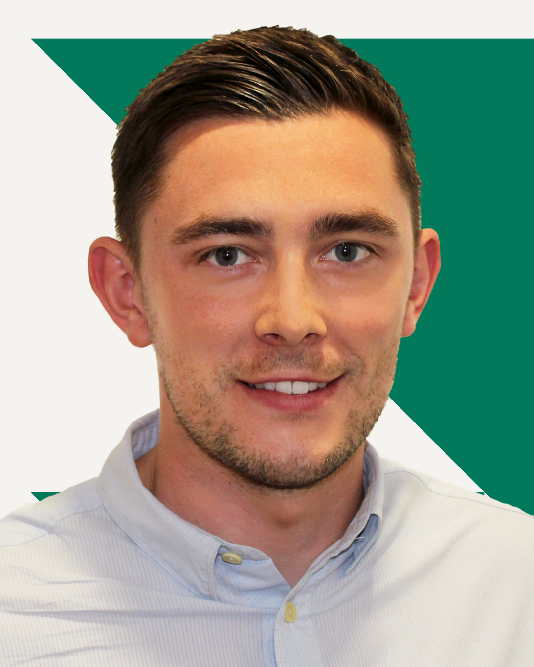 Scott Cook smiling, wearing a light blue button-down shirt, with a red geometric pattern behind him.