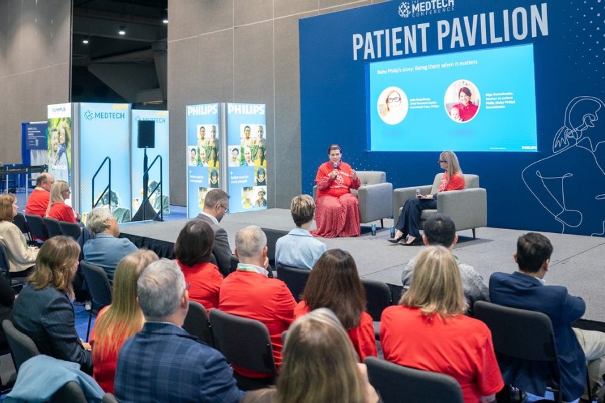 The MedTech Conference Patient Pavilion in Boston, featuring an on-stage discussion in front of an audience of medtech professionals.