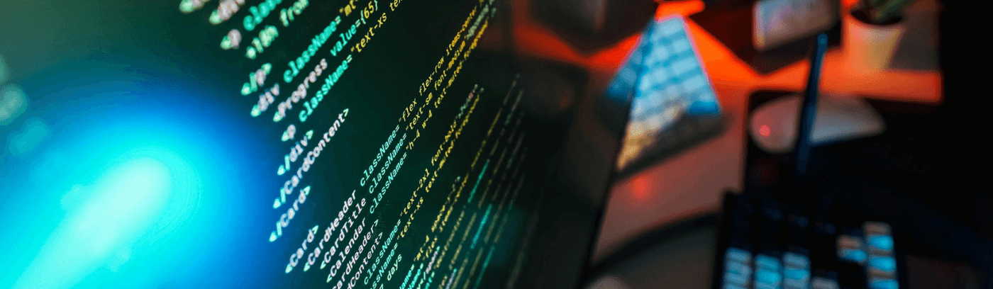 A close-up of a computer monitor showing various lines of programming code.