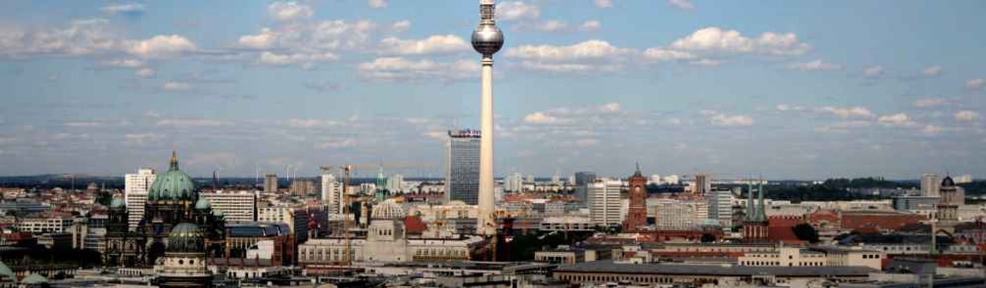 In the background, the Berlin Television Tower rises, a notable landmark defining the city's architectural landscape.