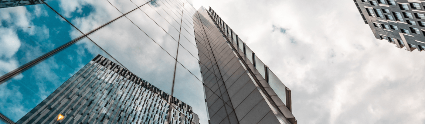 Contemporary skyscrapers rise above the London skyline, representing the modern architectural landscape of the city.