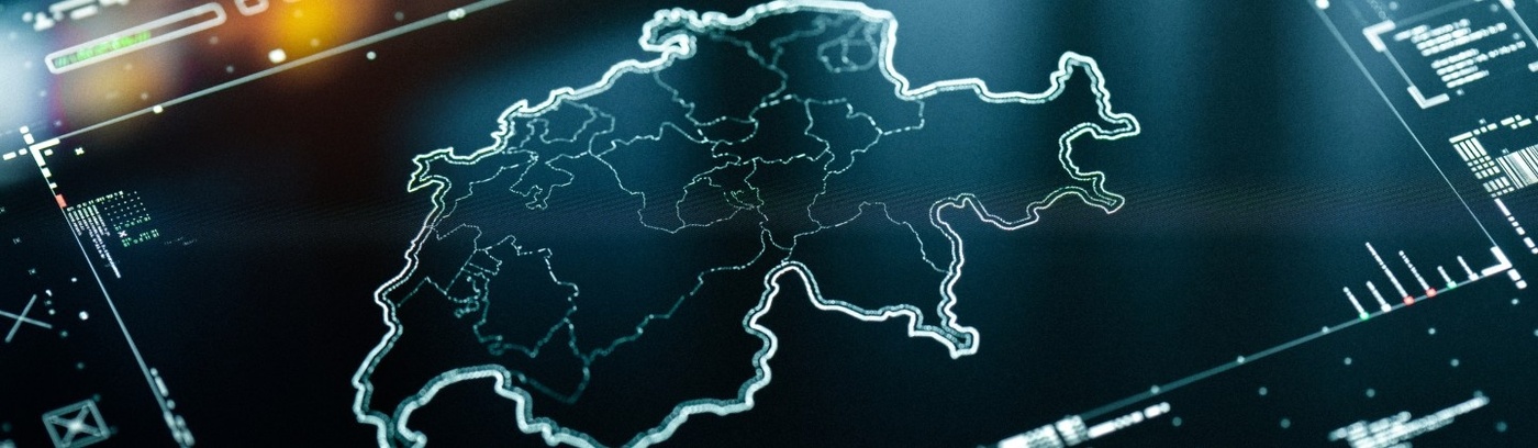 A computer monitor featuring a map of Switzerland, showcasing various regions and landmarks in a tech-oriented format.