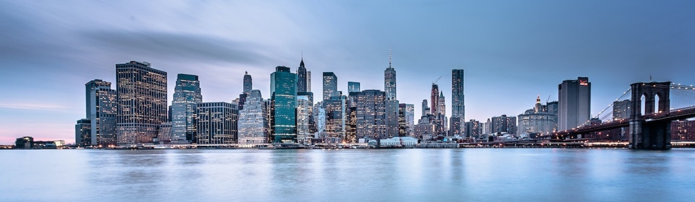 High rise buildings lined up looking like business centre by the sea. New York, Manhattan. 