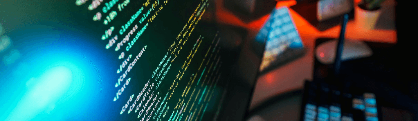 A close-up of a computer monitor showing various lines of programming code.