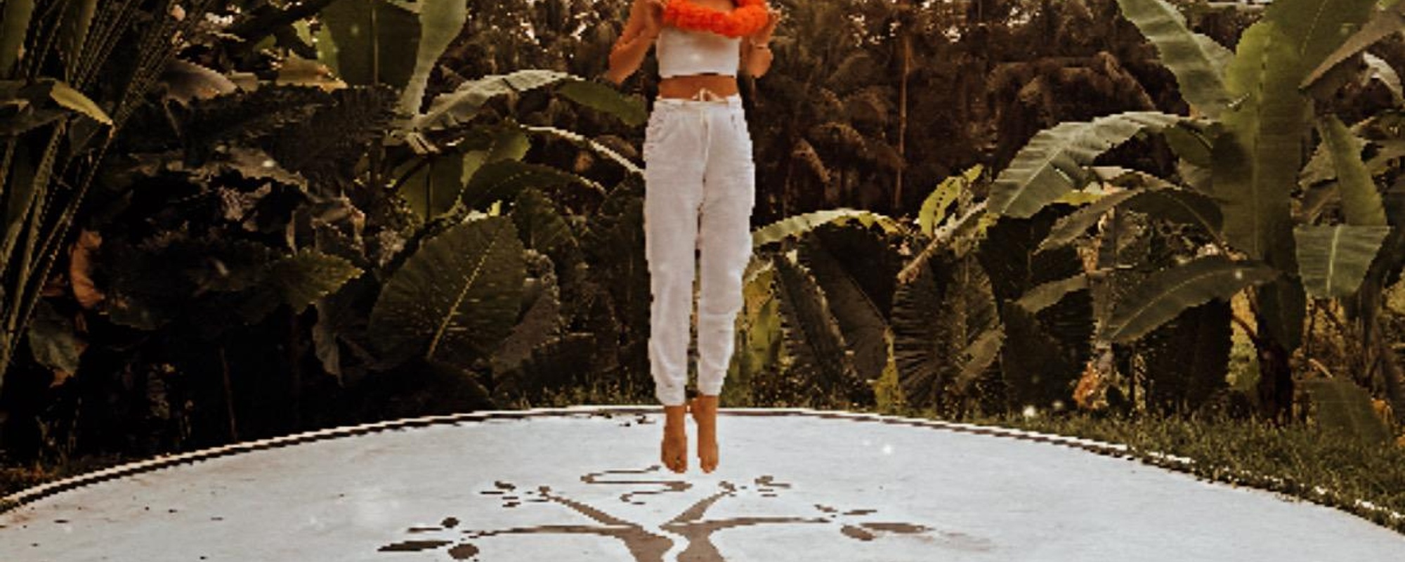 woman on trampoline jumping