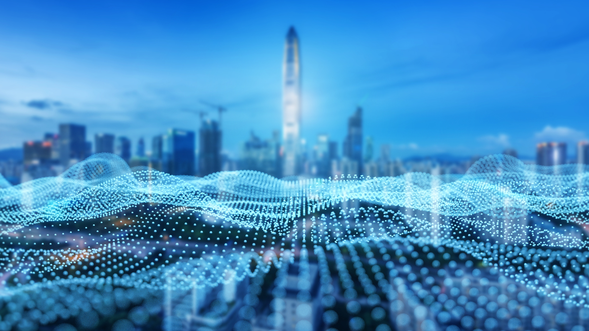 Abstract digital data wave made of glowing blue particles flowing across a city skyline, representing connected systems, real-time analytics, and digital twin technology in an urban environment.