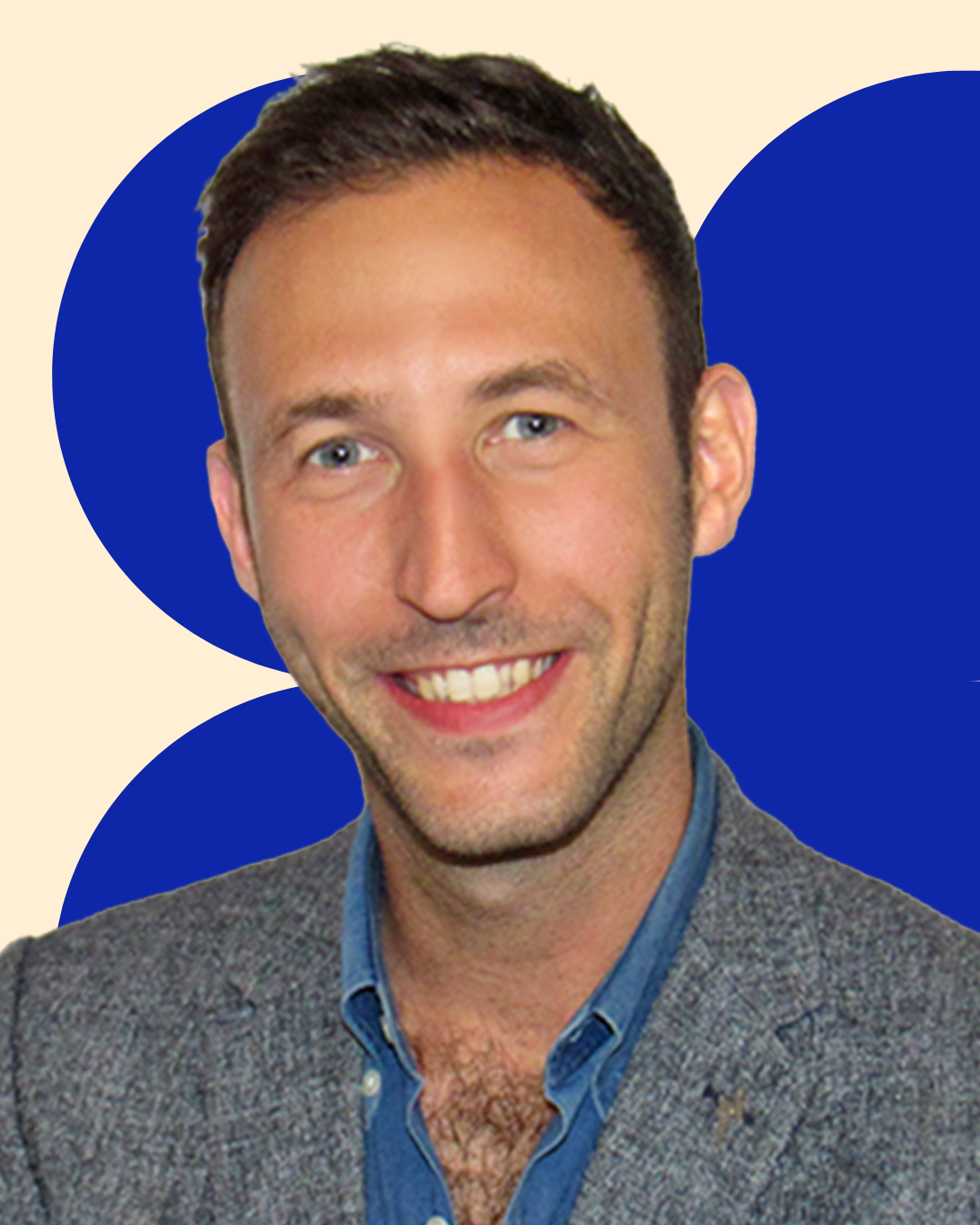 Headshot of Alex Cohen smiling in a grey blazer and blue shirt.